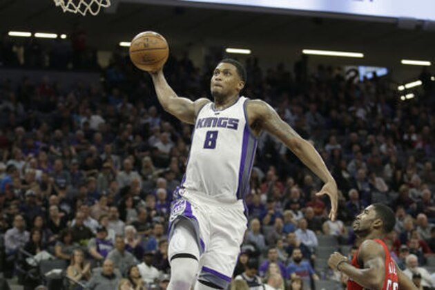 Sacramento Kings forward Rudy Gay, left, goes up for a dunk past New Orleans Pelicans guard E'Twaun Moore during the second half of an NBA basketball game in Sacramento, Calif., Tuesday, Nov. 8, 2016. The Kings won 102-94 .(AP Photo/Rich Pedroncelli)