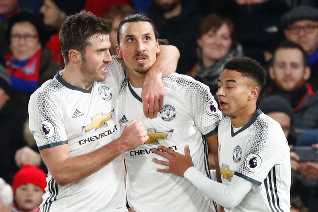 Manchester United's Swedish striker Zlatan Ibrahimovic (2L) celebrates scoring their second goal with Manchester United's English midfielder Michael Carrick (L) and Manchester United's English midfielder Jesse Lingard (R) during the English Premier League football match between Crystal Palace and Manchester United at Selhurst Park in south London on December 14, 2016. / AFP / Adrian DENNIS / RESTRICTED TO EDITORIAL USE. No use with unauthorized audio, video, data, fixture lists, club/league logos or 'live' services. Online in-match use limited to 75 images, no video emulation. No use in betting, games or single club/league/player publications.  /         (Photo credit should read ADRIAN DENNIS/AFP/Getty Images)