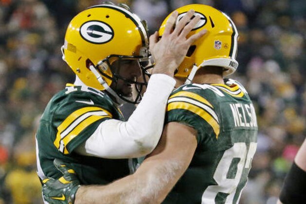 Green Bay Packers' Aaron Rodgers congratulates Jordy Nelson after a touchdown catch during the second half of an NFL football game against the Seattle Seahawks Sunday, Dec. 11, 2016, in Green Bay, Wis. (AP Photo/Mike Roemer)