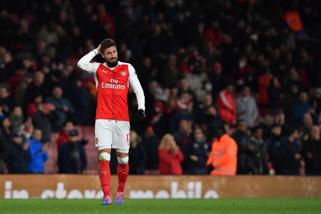 Arsenal's French striker Olivier Giroud gestures on the pitch after the English Premier League football match between Arsenal and Bournemouth at the Emirates Stadium in London on November 27, 2016.
Arsenal won the game 3-1. / AFP / Ben STANSALL / RESTRICTED TO EDITORIAL USE. No use with unauthorized audio, video, data, fixture lists, club/league logos or 'live' services. Online in-match use limited to 75 images, no video emulation. No use in betting, games or single club/league/player publications. / (Photo credit should read BEN STANSALL/AFP/Getty Images) Arsenal's French striker Olivier Giroud gestures on the pitch after the English Premier League football match between Arsenal and Bournemouth at the Emirates Stadium in London on November 27, 2016.
Arsenal won the game 3-1. / AFP / Ben STANSALL / RESTRICTED TO EDITORIAL USE. No use with unauthorized audio, video, data, fixture lists, club/league logos or 'live' services. Online in-match use limited to 75 images, no video emulation. No use in betting, games or single club/league/player publications. / (Photo credit should read BEN STANSALL/AFP/Getty Images)