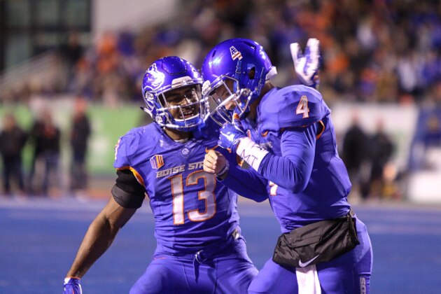 BOISE, ID - NOVEMBER 18: Running back Jeremy McNichols #13 congratulates quarterback Brett Rypien #4 of the Boise State Broncos after a touchdown run during first half action against the UNLV Rebels on November 18, 2016 at Albertsons Stadium in Boise, Idaho. (Photo by Loren Orr/Getty Images)