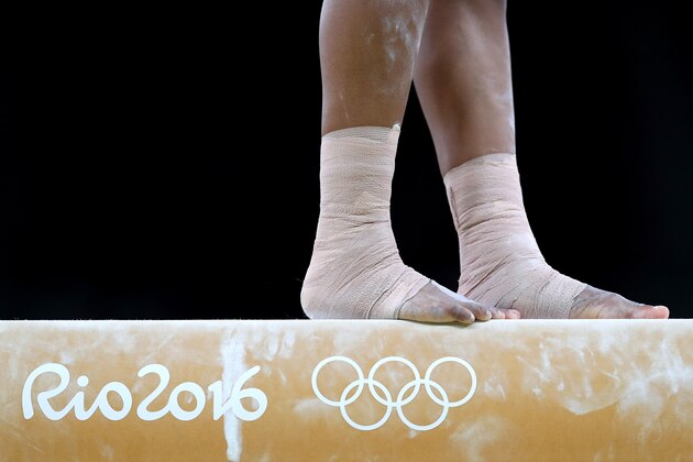 RIO DE JANEIRO, BRAZIL - AUGUST 07:  Gabrielle Douglas of the United States competes on the balance beam during Women's qualification for Artistic Gymnastics on Day 2 of the Rio 2016 Olympic Games at the Rio Olympic Arena on August 7, 2016 in Rio de Janeiro, Brazil  (Photo by Tom Pennington/Getty Images)