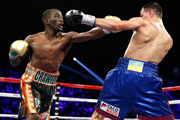 LAS VEGAS, NV - JULY 23:  WBO junior welterweight champion Terence Crawford (L) throws a punch at WBC champion Viktor Postol during their title unification fight at MGM Grand Garden Arena on July 23, 2016 in Las Vegas, Nevada. Crawford won the fight by unanimous decision. (Photo by Steve Marcus/Getty Images)