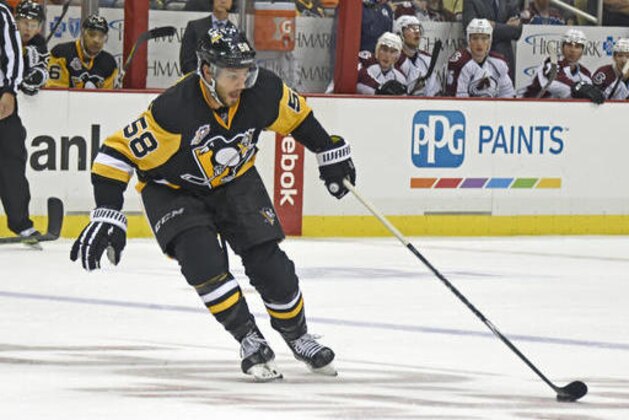 Pittsburgh Penguins defenseman Kris Letang (58) skates with the puck during an NHL hockey game against the Colorado Avalanche on Monday, Oct. 17, 2016, in Pittsburgh, PA. (AP Photo/Fred Vuich)
