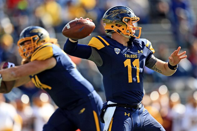 TOLEDO, OH - OCTOBER 22: Quarterback Logan Woodside #11 of the Toledo Rockets throws a pass against Central Michigan Chippewas at Glass Bowl on October 22, 2016 in Toledo, Ohio.  (Photo by Andrew Weber/Getty Images)