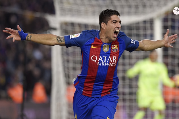 Barcelona's Uruguayan forward Luis Suarez celebrates a goal during the Spanish league football match FC Barcelona vs Real Madrid CF at the Camp Nou stadium in Barcelona on December 3, 2016. / AFP / LLUIS GENE        (Photo credit should read LLUIS GENE/AFP/Getty Images)