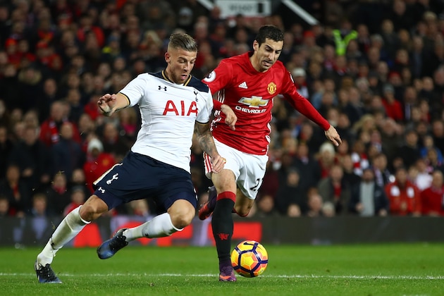 MANCHESTER, ENGLAND - DECEMBER 11:  Henrikh Mkhitaryan of Manchester United and Toby Alderweireld of Tottenham Hotspur compete for the ball during the Premier League match between Manchester United and Tottenham Hotspur at Old Trafford on December 11, 2016 in Manchester, England.  (Photo by Clive Brunskill/Getty Images)