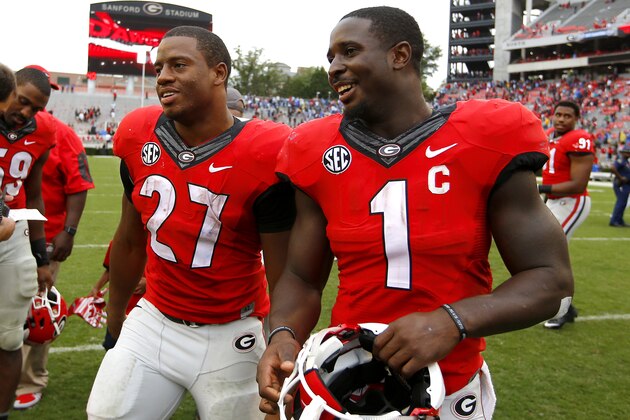 ATHENS, GA - SEPTEMBER 26: Running back Nick Chubb #27 of the Georgia Bulldogs celebrates with running back Sony Michel #1 at the conclusion of the game against the Southern University Jaguars on September 26, 2015 at Sanford Stadium in Athens, Georgia. The Georgia Bulldogs won 48-6. (Photo by Todd Kirkland/Getty Images)