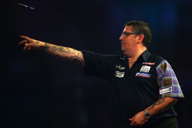 LONDON, ENGLAND - DECEMBER 15:  Gary Anderson of Scotland throws during his first round match against Mark Frost of England during day one of the 2017 William Hill PDC World Darts Championships at Alexandra Palace on December 15, 2016 in London, England.  (Photo by Alex Pantling/Getty Images)