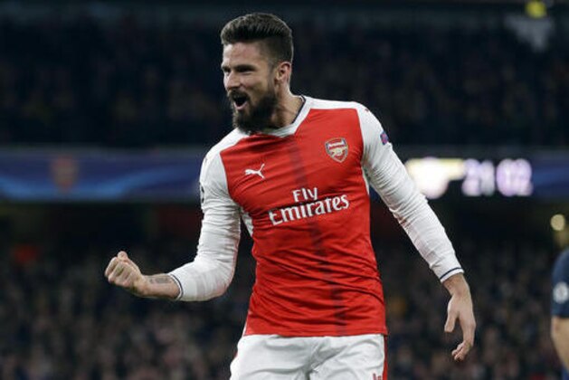 Arsenal's Olivier Giroud celebrates after their second goal during the Champions League group A soccer match between Arsenal and Paris Saint Germain at the Emirates stadium in London, Wednesday, Nov. 23, 2016. (AP Photo/Alastair Grant)