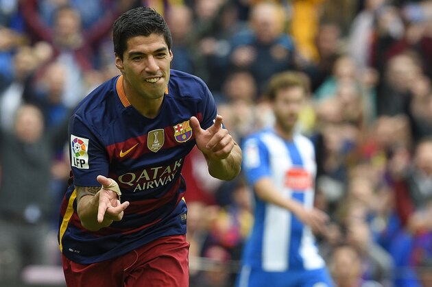 Barcelona's Uruguayan forward Luis Suarez celebrates after scoring a goal during the Spanish league football match FC Barcelona vs RCD Espanyol at the Camp Nou stadium in Barcelona on May 8, 2016. / AFP / LLUIS GENE        (Photo credit should read LLUIS GENE/AFP/Getty Images)