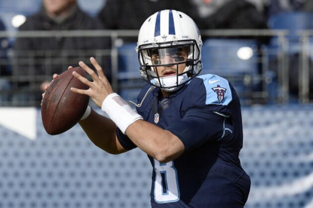 FILE - In this Sunday, Dec. 11, 2016 file photo, Tennessee Titans quarterback Marcus Mariota warms up before an NFL football game against the Denver Broncos in Nashville, Tenn. The Tennessee Titans are making believers out of lots of folks. The idea that they could win the AFC South is very much alive after their victory over Denver. Should the Titans come out of Kansas City with another win on Sunday, Dec. 18, 2016, the question might become are they good enough to not only make the playoffs, but do damage there.(AP Photo/Mark Zaleski, File)