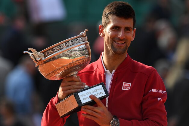 PARIS, FRANCE - JUNE 05:  Champion Novak Djokovic of Serbia poses with the trophy following his victory during the Men's Singles final match against Andy Murray of Great Britain on day fifteen of the 2016 French Open at Roland Garros on June 5, 2016 in Paris, France.  (Photo by Dennis Grombkowski/Getty Images)