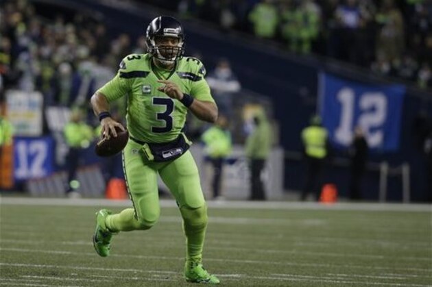 Seattle Seahawks quarterback Russell Wilson in action against the Los Angeles Rams in the second half of an NFL football game, Thursday, Dec. 15, 2016, in Seattle. (AP Photo/Elaine Thompson)