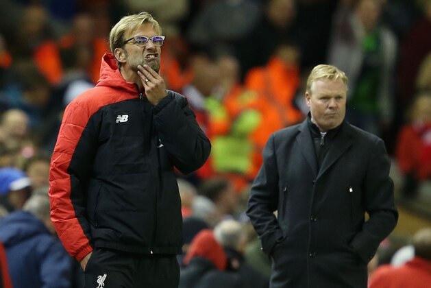 LIVERPOOL, ENGLAND - OCTOBER 25:  Jurgen Klopp (L), manager of Liverpool and Ronald Koeman (R) manager of Southampton look on during the Barclays Premier League match between Liverpool and Southampton at Anfield on October 25, 2015 in Liverpool, England.  (Photo by Jan Kruger/Getty Images)