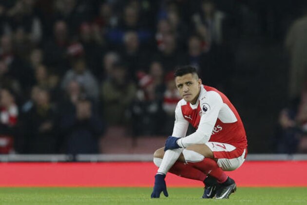 Arsenal's Alexis Sanchez looks across the pitch before the English Premier League soccer match between Arsenal and Stoke City at the Emirates stadium in London, Saturday Dec. 10, 2016. (AP Photo/Tim Ireland)