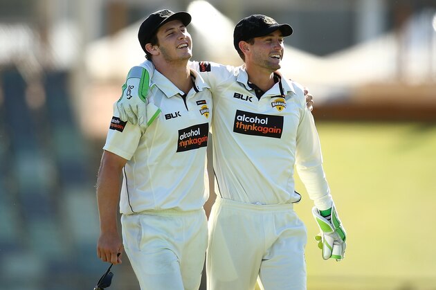 PERTH, AUSTRALIA - DECEMBER 07: Hilton Cartwright and Sam Whiteman of Western Australia share a moment after a wicket during day three of the Sheffield Shield match between Western Australia and Queensland at WACA on December 7, 2016 in Perth, Australia.  (Photo by Paul Kane/Getty Images)