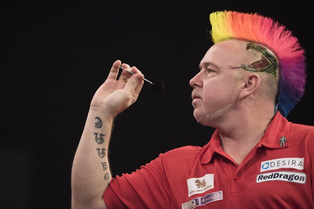 Wolverhampton, ENGLAND- November 20: Peter Wright of Scotland plays a shot in his semi-final match against Michael van Gerwen of the Netherlands during the SINGHA Beer Grand Slam of Darts at Wolverhampton Civic Hall on November 20, 2016 in Wolverhampton, England (Photo by Nathan Stirk/Getty Images).