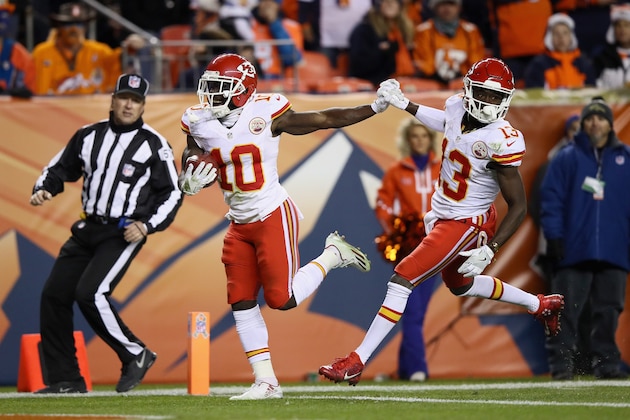 DENVER, CO - NOVEMBER 27:  Tyreek Hill #10 of the Kansas City Chiefs holds hands with De'Anthony Thomas #13 as he runs in for a touchdown against the Denver Broncos at Sports Authority Field at Mile High on November 27, 2016 in Denver, Colorado.  (Photo by Ezra Shaw/Getty Images)
