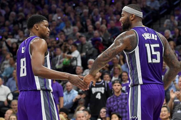 SACRAMENTO, CA - OCTOBER 27:  DeMarcus Cousins #15 of the Sacramento Kings is congratulated by Rudy Gay #8 after Cousins scored a basket against the San Antonio Spurs during the second quarter of an NBA basketball game at Golden 1 Center on October 27, 2016 in Sacramento, California. NOTE TO USER: User expressly acknowledges and agrees that, by downloading and or using this photograph, User is consenting to the terms and conditions of the Getty Images License Agreement.  (Photo by Thearon W. Henderson/Getty Images)