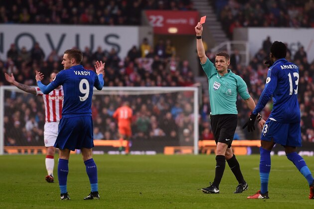English referee Craig Pawson (C) shows a red card to Leicester City's English striker Jamie Vardy (2L) during the English Premier League football match between Stoke City and Leicester City at the Bet365 Stadium in Stoke-on-Trent, central England on December 17, 2016. / AFP / Paul ELLIS / RESTRICTED TO EDITORIAL USE. No use with unauthorized audio, video, data, fixture lists, club/league logos or 'live' services. Online in-match use limited to 75 images, no video emulation. No use in betting, games or single club/league/player publications.  /         (Photo credit should read PAUL ELLIS/AFP/Getty Images)