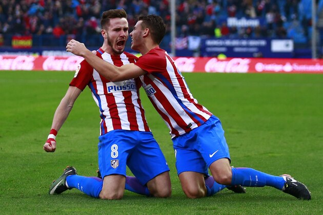 MADRID, SPAIN - DECEMBER 17: Saul Niguez (L) of Atletico de Madrid celebrates scoring their opening goal with teammate Lucas Hernandez (R) during the La Liga match between Club Atletico de Madrid and UD Las Palmas at Vicente Calderon Stadium on December 17, 2016 in Madrid, Spain. (Photo by Gonzalo Arroyo Moreno/Getty Images)