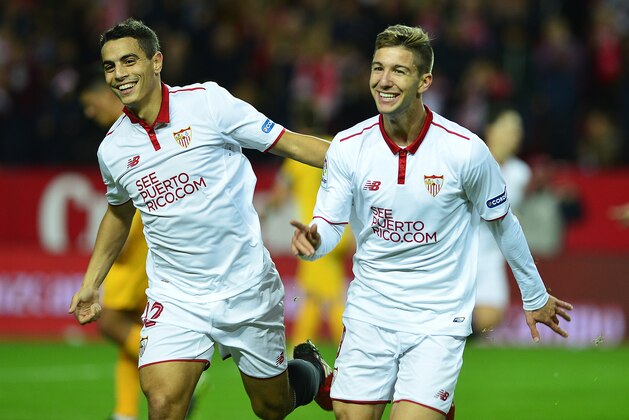 Sevilla's Argentinian forward Luciano Vietto (R) celebrates a goal with Sevilla's French forward Wissam Ben Yedder during the Spanish league football match Sevilla FC vs Malaga CF at the Ramon Sanchez Pizjuan stadium in Sevilla on December 17, 2016. / AFP / CRISTINA QUICLER        (Photo credit should read CRISTINA QUICLER/AFP/Getty Images)