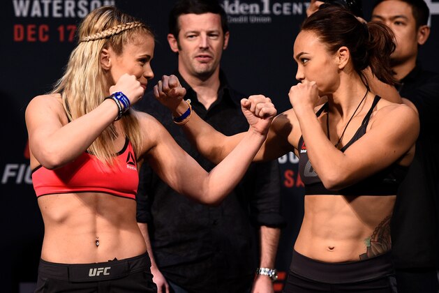 SACRAMENTO, CA - DECEMBER 16:  (L-R) Paige VanZant and Michelle Waterson face off during the UFC Fight Night weigh-in inside the Golden 1 Center Arena on December 16, 2016 in Sacramento, California. (Photo by Jeff Bottari/Zuffa LLC/Zuffa LLC via Getty Images)