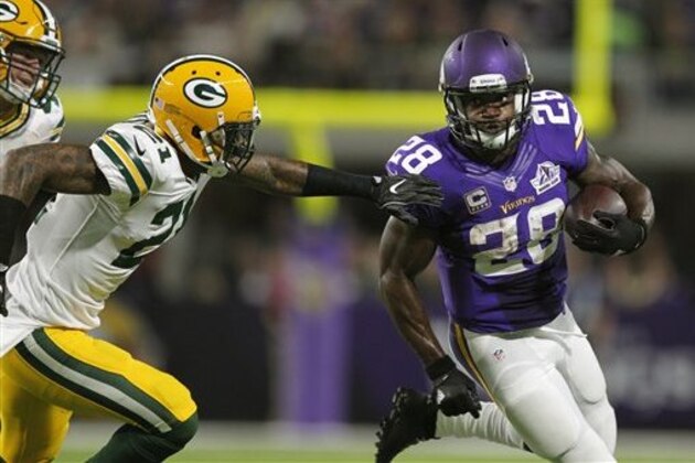 Minnesota Vikings running back Adrian Peterson (28) runs from Green Bay Packers free safety Ha Ha Clinton-Dix, left, during the first half of an NFL football game Sunday, Sept. 18, 2016, in Minneapolis. (AP Photo/Andy Clayton-King)