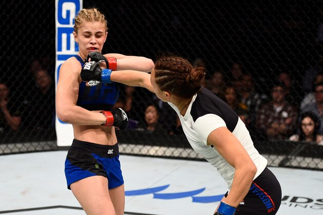 SACRAMENTO, CA - DECEMBER 17:  (R-L) Michelle Waterson punches Paige VanZant in their women's strawweight bout during the UFC Fight Night event inside the Golden 1 Center Arena on December 17, 2016 in Sacramento, California. (Photo by Jeff Bottari/Zuffa LLC/Zuffa LLC via Getty Images)