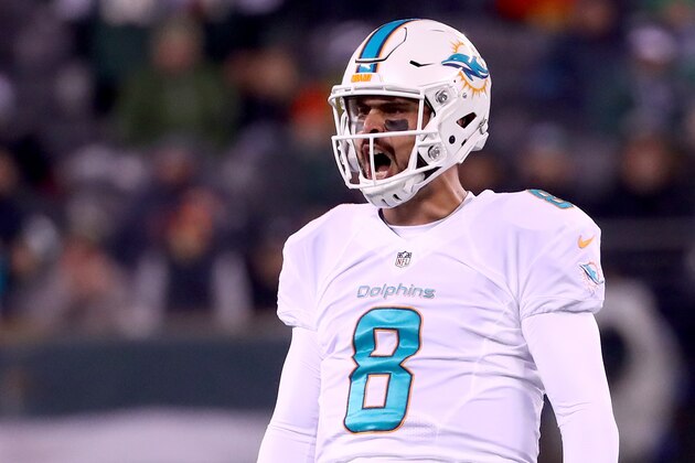 EAST RUTHERFORD, NJ - DECEMBER 17:  Matt Moore #8 of the Miami Dolphins celebrates after throwing a 52 yard touchdown pass to Kenny Stills #10 against the New York Jets during the second quarter of the game at MetLife Stadium on December 17, 2016 in East Rutherford, New Jersey.  (Photo by Al Bello/Getty Images)