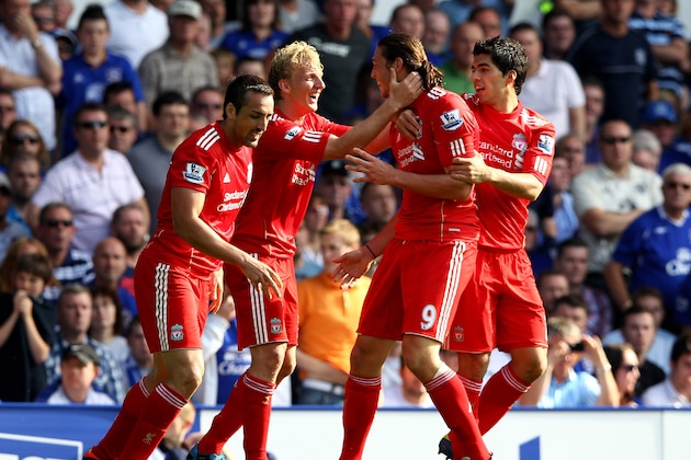 LIVERPOOL, ENGLAND - OCTOBER 01:  Andy Carroll of Liverpool is congratulated by Dirk Kuyt and his team mates after scoring the opening goal during the Barclays Premier League match between Everton and Liverpool at Goodison Park on October 1, 2011 in Liverpool, England.  (Photo by Clive Brunskill/Getty Images)