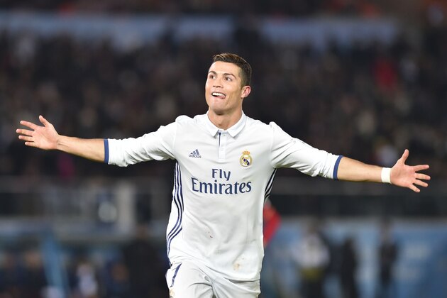 Real Madrid forward Cristiano Ronaldo celebrates scoring during extra-time of the Club World Cup football final match between Kashima Antlers of Japan and Real Madrid of Spain at Yokohama International stadium in Yokohama on December 18, 2016. / AFP / Kazuhiro NOGI        (Photo credit should read KAZUHIRO NOGI/AFP/Getty Images)