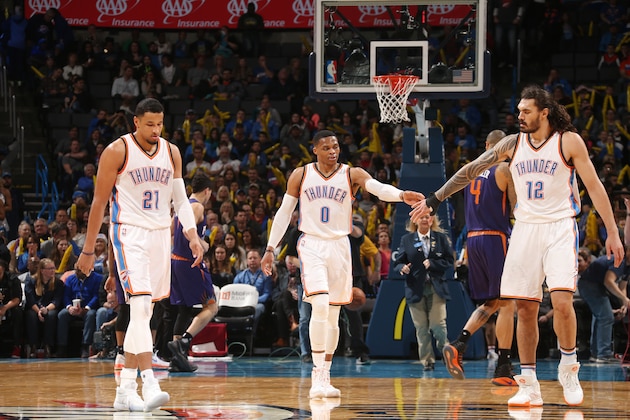 OKLAHOMA CITY, OK - DECEMBER 17:  Russell Westbrook #0, Andre Roberson #21 and Steven Adams #12 of the Oklahoma City Thunder shake hands during the game against the Phoenix Suns on December 17, 2016 at Chesapeake Energy Arena in Oklahoma City, Oklahoma. NOTE TO USER: User expressly acknowledges and agrees that, by downloading and or using this photograph, User is consenting to the terms and conditions of the Getty Images License Agreement. Mandatory Copyright Notice: Copyright 2016 NBAE (Photo by Layne Murdoch/NBAE via Getty Images)