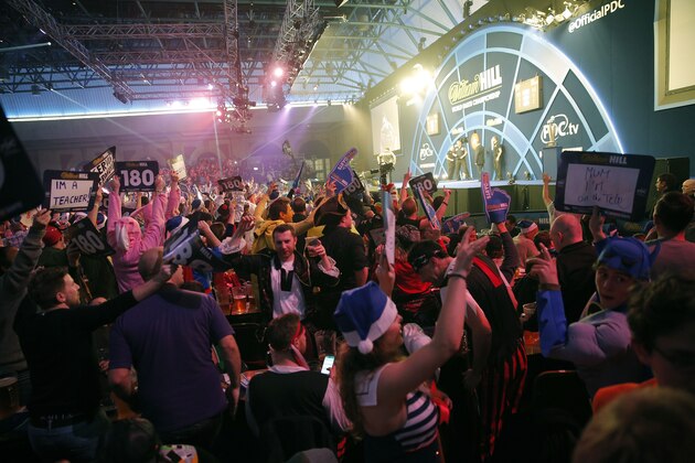 Packed crowd celebrate during the Gary Anderson v Adrian Lewis PDC World Darts Championship Final on January 3rd 2016 in London (Photo by Tom Jenkins/Getty Images)