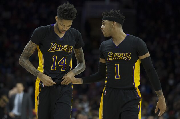 PHILADELPHIA, PA - DECEMBER 16: Brandon Ingram #14 and D'Angelo Russell #1 of the Los Angeles Lakers talk to each other after a timeout in the first quarter against the Philadelphia 76ers at Wells Fargo Center on December 16, 2016 in Philadelphia, Pennsylvania. The Lakers defeated the 76ers 100-89. NOTE TO USER: User expressly acknowledges and agrees that, by downloading and or using this photograph, User is consenting to the terms and conditions of the Getty Images License Agreement. (Photo by Mitchell Leff/Getty Images)