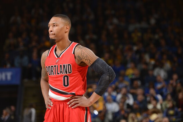 OAKLAND, CA - DECEMBER 17:  Damian Lillard #0 of the Portland Trail Blazers looks on during the game against the Golden State Warriors on December 17, 2016 at ORACLE Arena in Oakland, California. NOTE TO USER: User expressly acknowledges and agrees that, by downloading and or using this photograph, user is consenting to the terms and conditions of Getty Images License Agreement. Mandatory Copyright Notice: Copyright 2016 NBAE (Photo by Noah Graham/NBAE via Getty Images)
