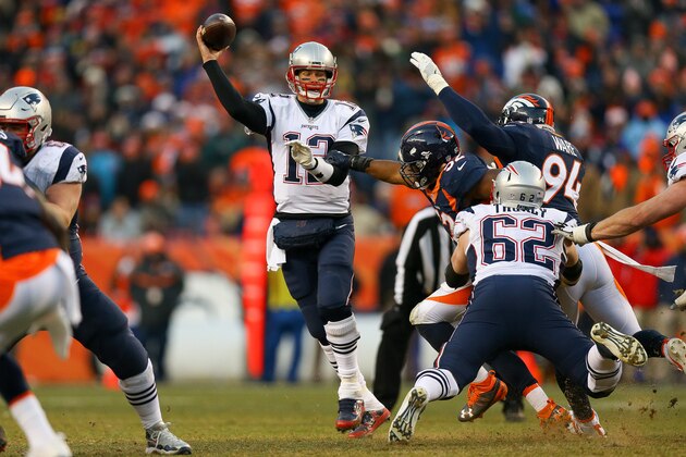 DENVER, CO - DECEMBER 18:  Quarterback Tom Brady #12 of the New England Patriots passes under pressure by inside linebacker Corey Nelson #52 of the Denver Broncos in the third quarter at Sports Authority Field at Mile High on December 18, 2016 in Denver, Colorado. (Photo by Justin Edmonds/Getty Images)