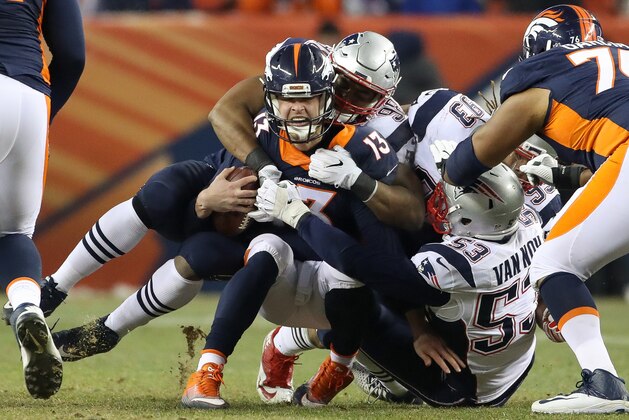 DENVER, CO - DECEMBER 18:  Quarterback Trevor Siemian #13 of the Denver Broncos is sacked by defensive end Trey Flowers #98 of the New England Patriots in the fourth quarter at Sports Authority Field at Mile High on December 18, 2016 in Denver, Colorado. (Photo by Matthew Stockman/Getty Images)