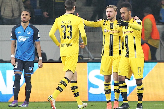 4Dortmund's Gabonese forward Pierre-Emerick Aubameyang (R) celebrates scoring the 2-2 with his team-mates vie for the ball during the German first division Bundesliga football match between TSG Hoffenheim and BVB Borussia Dortmund at the Wirsol Rhein-Neckar-Arena in Sinsheim, southern Germany, on December 16, 2016. / AFP / Daniel ROLAND / RESTRICTIONS: DURING MATCH TIME: DFL RULES TO LIMIT THE ONLINE USAGE TO 15 PICTURES PER MATCH AND FORBID IMAGE SEQUENCES TO SIMULATE VIDEO. == RESTRICTED TO EDITORIAL USE == FOR FURTHER QUERIES PLEASE CONTACT DFL DIRECTLY AT + 49 69 650050
        (Photo credit should read DANIEL ROLAND/AFP/Getty Images)