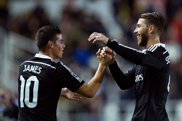 MADRID, SPAIN - APRIL 08: James Rodriguez (L) of Real Madrid CF celebrates scoring their second goal Sergio Ramos (R) during the La Liga match between Rayo Vallecano de Madrid and Real Madrid CF at Vallecas Stadium on April 8, 2015 in Madrid, Spain.  (Photo by Gonzalo Arroyo Moreno/Getty Images)