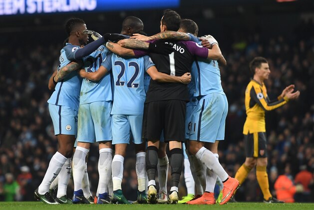 MANCHESTER, ENGLAND - DECEMBER 18:  The Manchester City team celebrate after the final whistle during the Premier League match between Manchester City and Arsenal at the Etihad Stadium on December 18, 2016 in Manchester, England.  (Photo by Michael Regan/Getty Images)