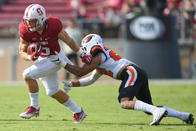PALO ALTO, CA - NOVEMBER 05:  Christian McCaffrey #5 of the Stanford Cardinal breaks the tackle of Xavier Crawford #22 of the Oregon State Beavers during the third quarter of their NCAA football game at Stanford Stadium on November 5, 2016 in Palo Alto, California.  (Photo by Thearon W. Henderson/Getty Images)