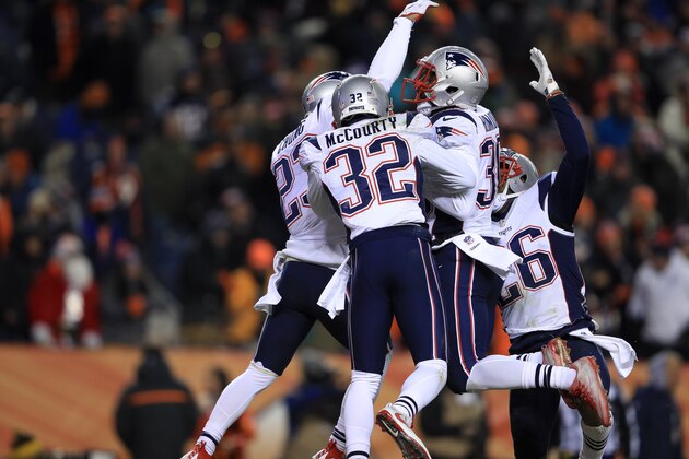 DENVER, CO - DECEMBER 18:  Free safety Devin McCourty #32 of the New England Patriots and teammates celebrate after breaking up a pass in the fourth quarter at Sports Authority Field at Mile High on December 18, 2016 in Denver, Colorado. (Photo by Sean M. Haffey/Getty Images)