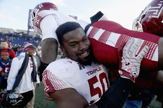 ANNAPOLIS, MD - DECEMBER 03: Praise Martin-Oguike #50 of the Temple Owls picks up quarterback Phillip Walker #8 following the Owls 34-10 win over the Navy Midshipmen during the AAC Championship game at Navy-Marine Corps Memorial Stadium on December 3, 2016 in Annapolis, Maryland.  (Photo by Rob Carr/Getty Images)