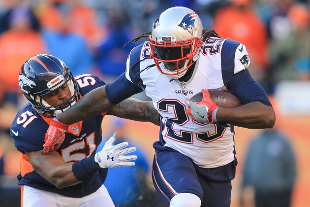 DENVER, CO - DECEMBER 18:  Running back LeGarrette Blount #29 of the New England Patriots rushes as inside linebacker Todd Davis #51 of the Denver Broncos attempts a tackle in the first quarter of a game at Sports Authority Field at Mile High on December 18, 2016 in Denver, Colorado. (Photo by Sean M. Haffey/Getty Images)