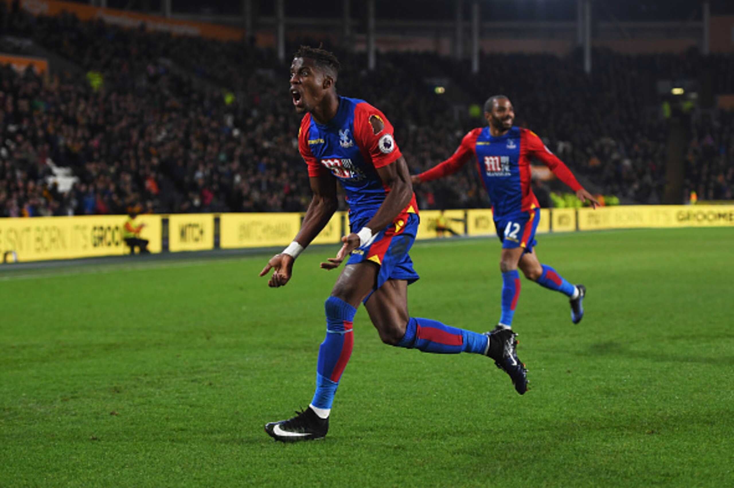 HULL, ENGLAND - DECEMBER 10:  Wilfried Zaha of Crystal Palace celebrates as he scores their second goal during the Premier League match between Hull City and Crystal Palace at KCOM Stadium on December 10, 2016 in Hull, England.  (Photo by Gareth Copley/Getty Images)