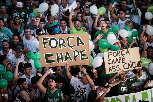 People gather in front of the Maracana stadium during a tribute for the victims of Brazilian Chapecoense Real football team killed in a plane crash in Colombia on November 29, in Rio de Janeiro, Brazil, on December 7, 2016. / AFP / YASUYOSHI CHIBA        (Photo credit should read YASUYOSHI CHIBA/AFP/Getty Images)