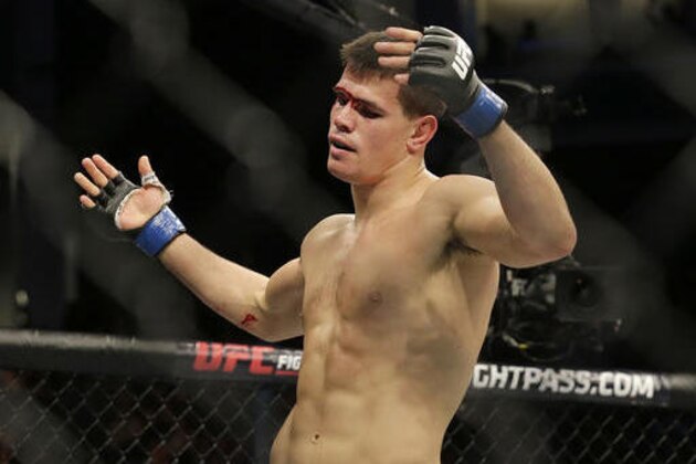 Mickey Gall reacts after beating Sage Northcutt by submission during the second round of a UFC Fight Night mixed martial arts fight in Sacramento, Calif., Saturday, Dec. 17, 2016. (AP Photo/Jeff Chiu)