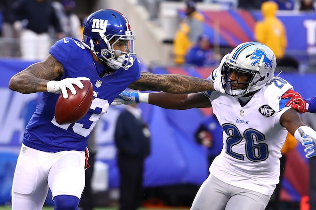 EAST RUTHERFORD, NJ - DECEMBER 18:  Odell Beckham #13 of the New York Giants returns a punt against  Don Carey #26 of the Detroit Lions during their game at MetLife Stadium on December 18, 2016 in East Rutherford, New Jersey.  (Photo by Al Bello/Getty Images)
